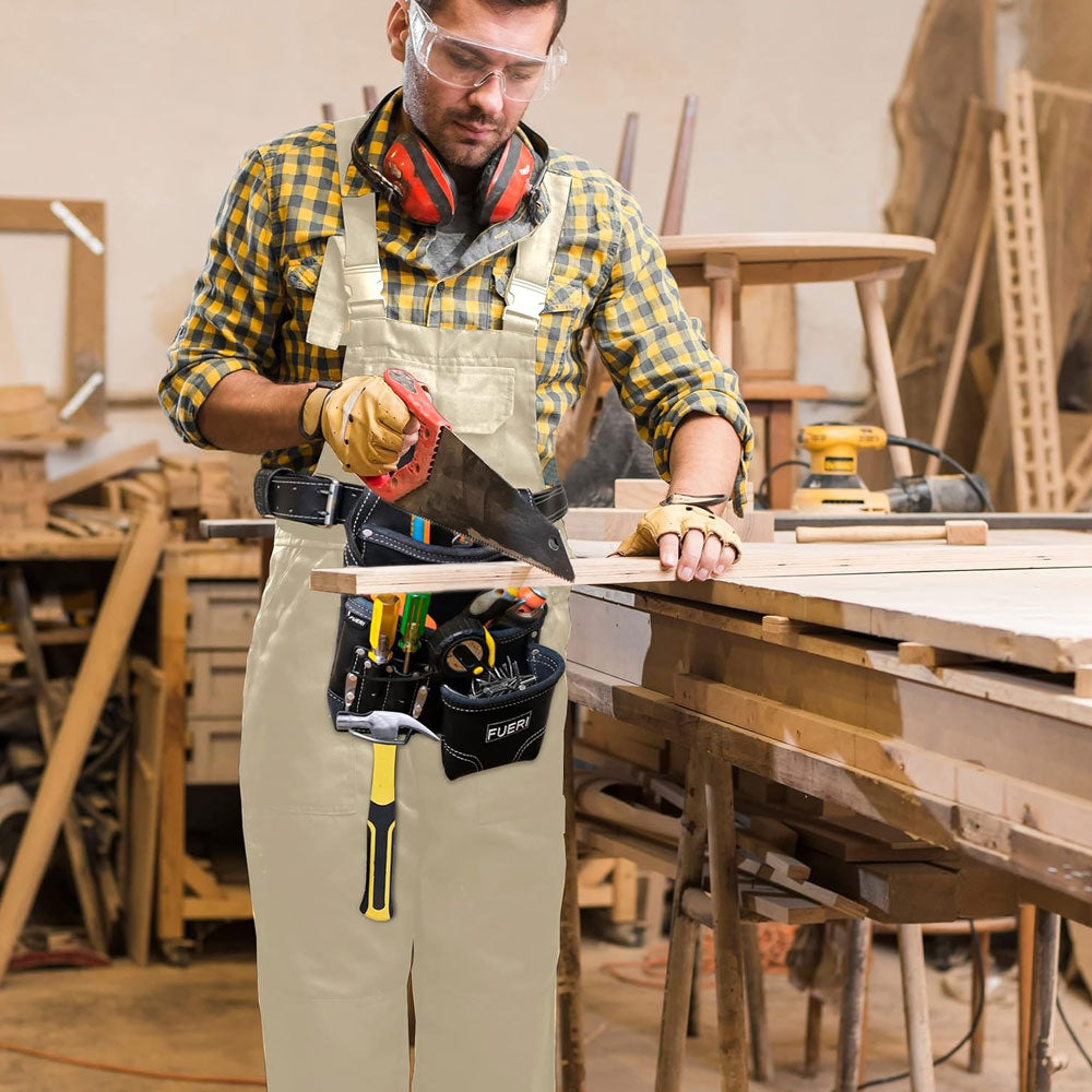 A carpenter working in a workshop, a saw in his hand, wearing  goggles, cutting wood piece, wearing FUERI 6 Pockets Tool Belt Pouch full of tools.