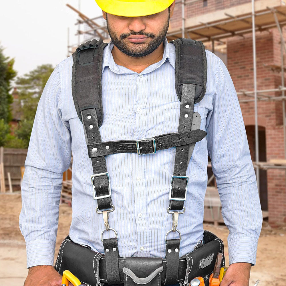 front view of a construction worker wearing heavy duty cardura fabric leather tool belt suspender attached with leather worker belt with d rings