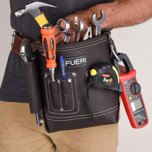 A close view of man's waist wearing Fueri 4 pockets chocolate leather electricians tool pouch with Fueri black leather tool belt. Tools in all pockets.